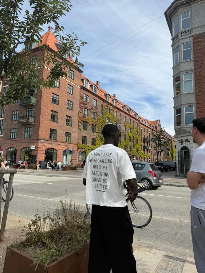 Doomscroll 'Away' Tee worn on a city street